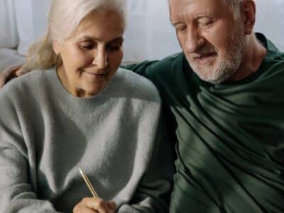 Retired couple looking at document